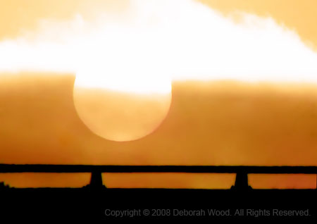 Sunrise over a  bridge
